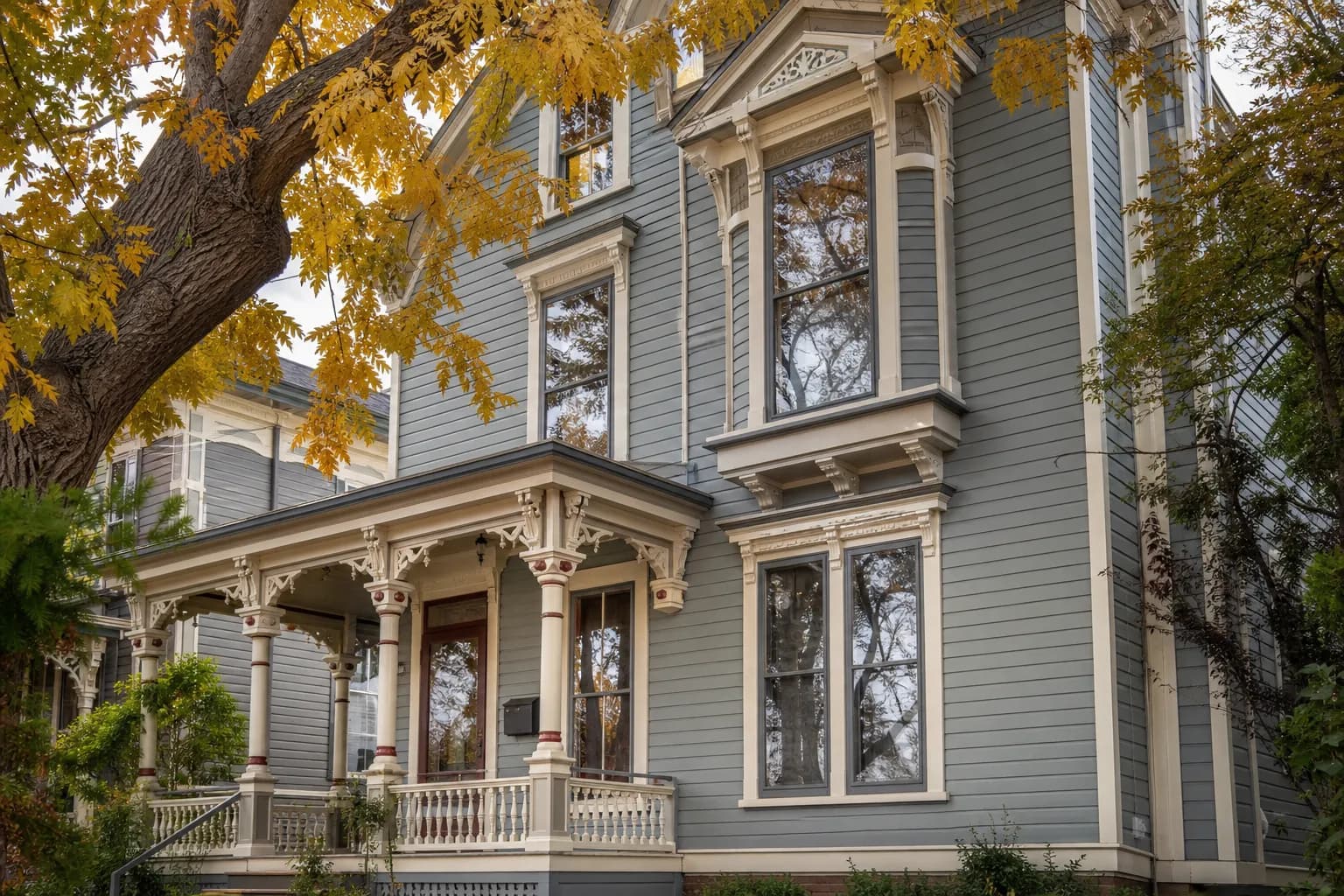 Victorian house with tall original wood windows protected by slim exterior storm windows.